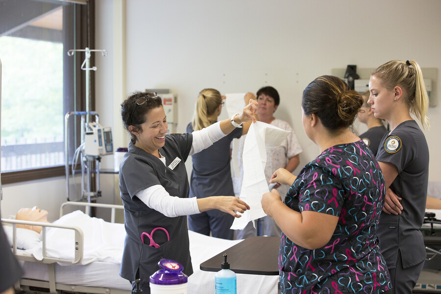 nursing students practicing with sanitary preparation