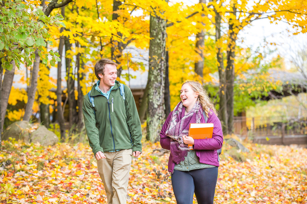 male and female students walking from class