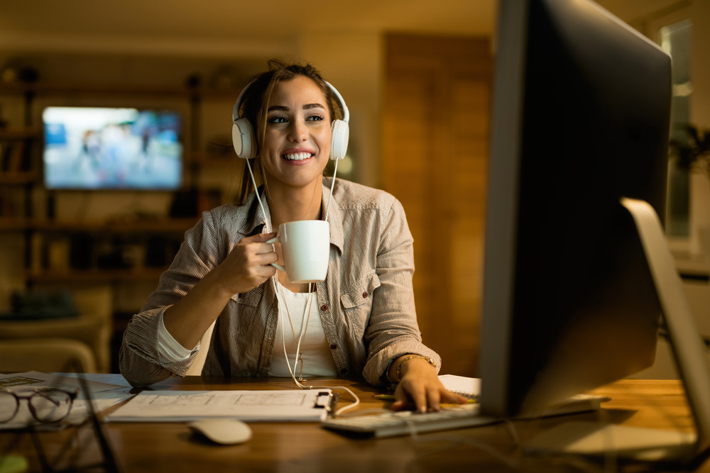 female working or studying from home in kitchen