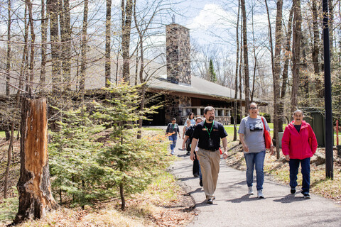 admissions rep giving a campus tour to a group of students