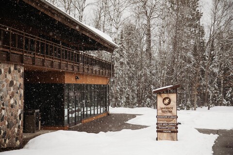 A snowy landscape at Nicolet College with the Lakeside Center in the foreground.